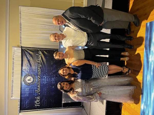 Erik & Ada Neikens supporting water safety charity at a formal anniversary gala event